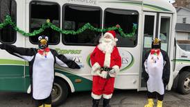Santa, 2 penguins and 20 helpers make special food delivery