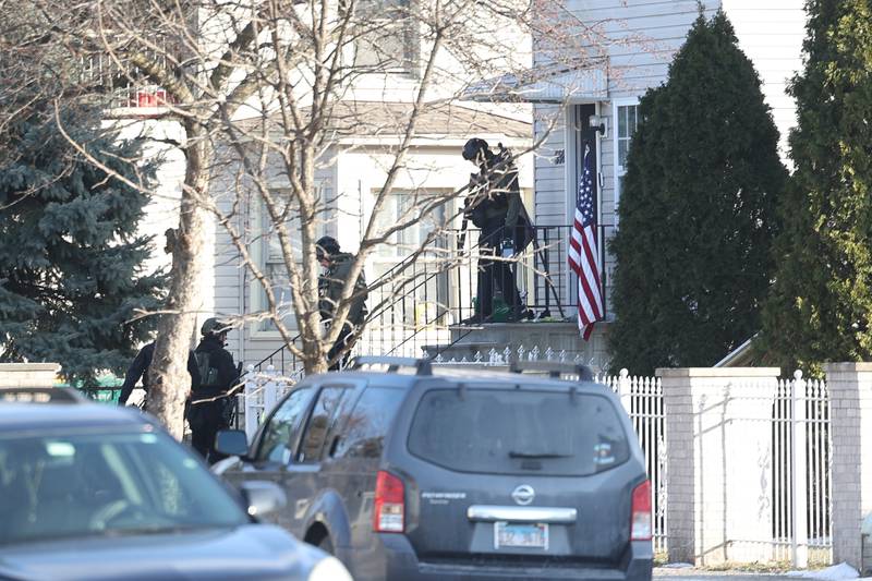 Joliet police leave a home along the 500 block of Irving Street after a standoff on Thursday, Jan. 9, 2025 in Joliet.