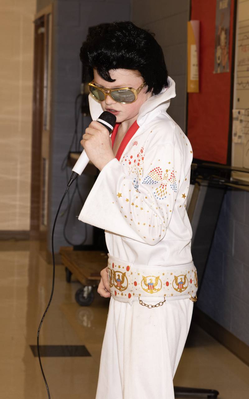 Nolan Rockey, a third-generation Elvis fan, performs "Hound Dog" to a sold-out audiance Tuesday afternoon. Rockey sold tickets to his show with a three-song set list as part of the Project Lemonade Day Market.