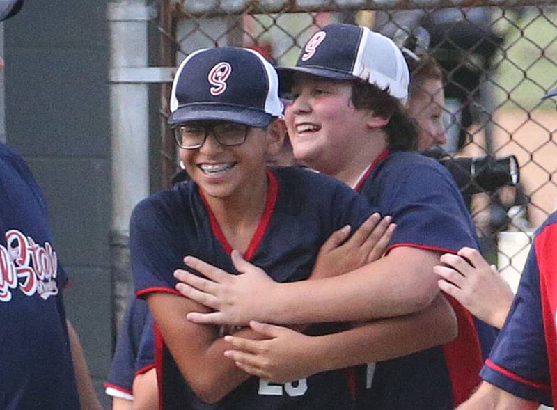 Streator All Stars pitcher Ben Mascode and teammate Noah Rodriguez react after defeating Ottawa American during the District 20 championship game on Sunday, July 14, 2024 at Washington Park in Peru.
