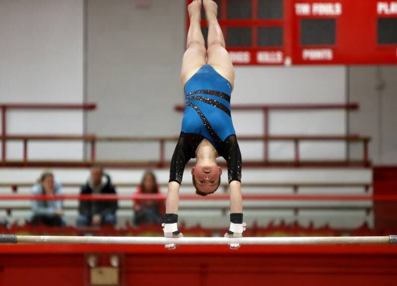 Neuqua Valley’s Ella Buchenauer competes on the uneven bars during the Hinsdale Central Sectional on Monday, Feb. 10, 2025 in Hinsdale.