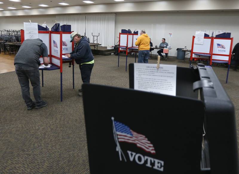 Voters fill their ballots out at the Knights of Columbus Hall on Tuesday, Nov. 8, 2022 in Ottawa.