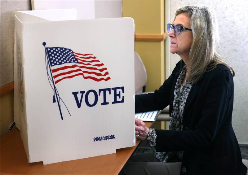 Trish Diedrich, from Sycamore, uses one of the Express Vote machines to cast her ballot Thursday, Sept. 26, 2024, during the first day of early voting for the Nov. election at the DeKalb County Legislative Center in Sycamore.