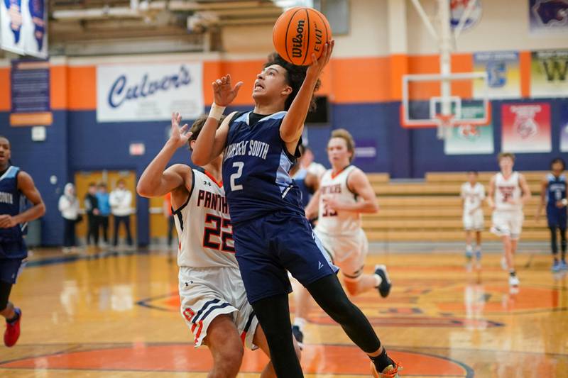 Plainfield South's Corey Nobles (2) drives to the hoop against Oswego’s Luke Roller (22) during a basketball game at Oswego High School on Friday, January 17, 2025.