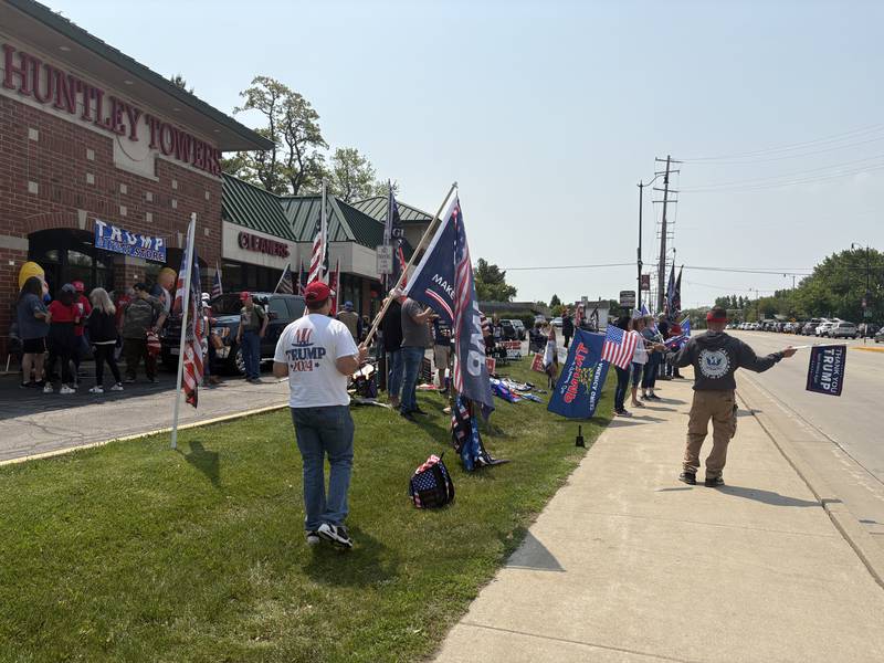 People rally outside the Trump and Truth Store in Huntley May 31, 2025.