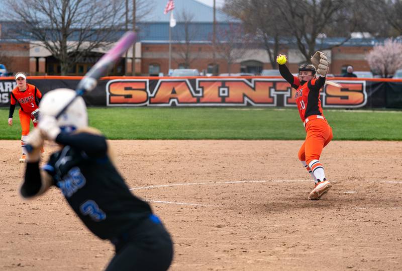 St. Charles East's Izzy Howe (10) delivers a pitch against St. Charles North during a softball game at St. Charles East High School on Monday, April 25, 2022.