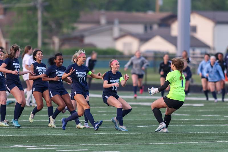 Downers Grove South celebrates their Class 3A Addison Trail Regional final soccer match win over Downers Grove North.  May 19, 2023.