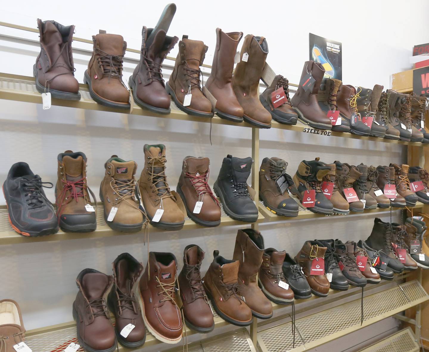 Dozens of boots and hiking shoes are available at Vlastnik's Mensware on Monday, Nov. 6, 2023 in Peru. Fourth-quarter sales at local small businesses are on the rise throughout the Illinois Valley.