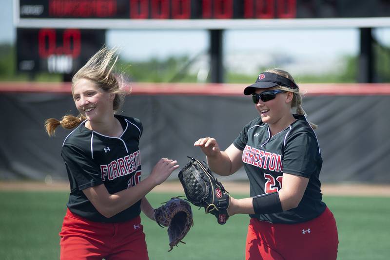 Forreston’s Jenna Greenfield (left) and Aubrey Sanders celebrate on the final out of the game against Newark Saturday, June 4, 2022 during the IHSA Class 1A softball state third place game. The Forreston Cardinals took 3rd place at the state tourney. June 4 2022 during the IHSA Class 1A softball state third place game.