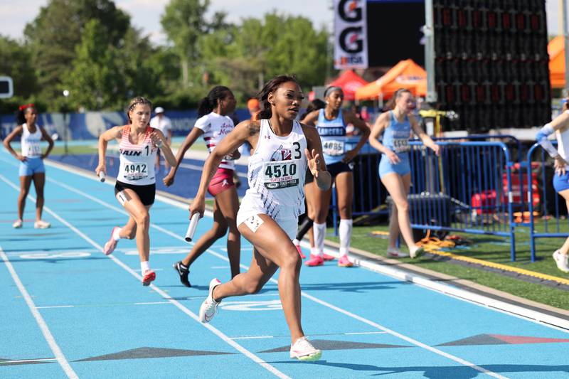 Kankakee’s Naomi Bey-Osborne competes in the 4x400 relay during the IHSA Class 3A Girls Track & Field State Finals on Saturday, May 24, 2025.