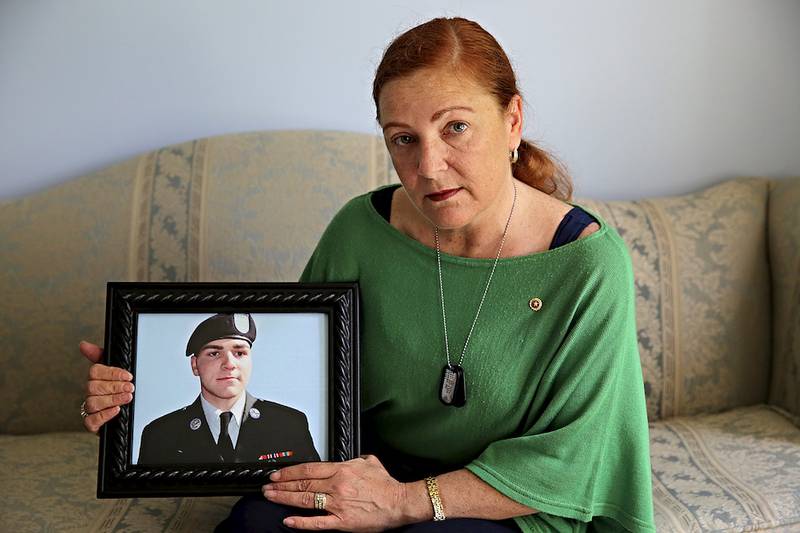 Denise Meehan of Plainfield holds a photograph of her son, Army Pfc. Andrew Meari, who was killed in a bomb blast while serving in Afghanistan in November 2010.
