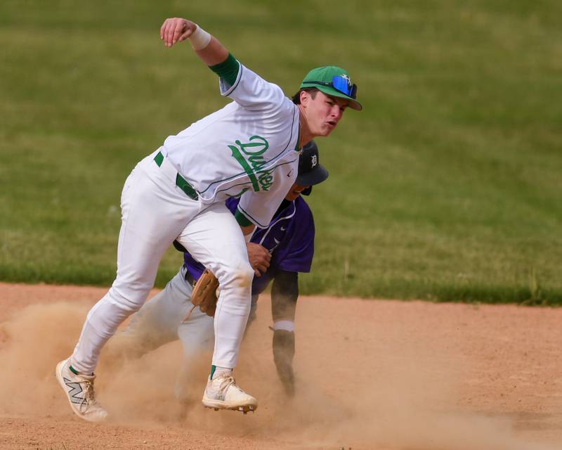 York's Luke Pieczynski, left, tags out base runner Emilio Gandarilla of Downers grove North during the game on Monday May 19, 2025, held at York High School in Elmhurst.