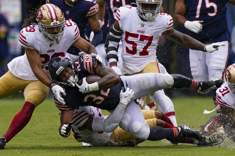 Chicago Bears running back David Montgomery is stopped during the first half  against the San Francisco 49ers, Sunday, Sept. 11, 2022, in Chicago.