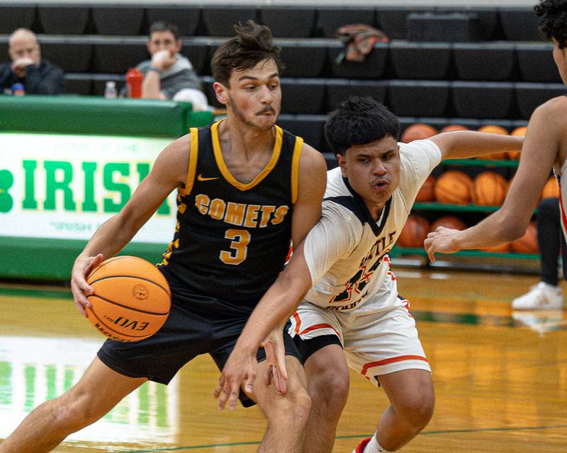 Jesse Tresouthick (3) of Reed-Custer dribbles ball as Enrique 'Kike' Lopez (13) of DePue reaches across body to steal ball during game in the Shipyard Showdown on Tuesday, December 23, 2025 at Seneca High School in Seneca.