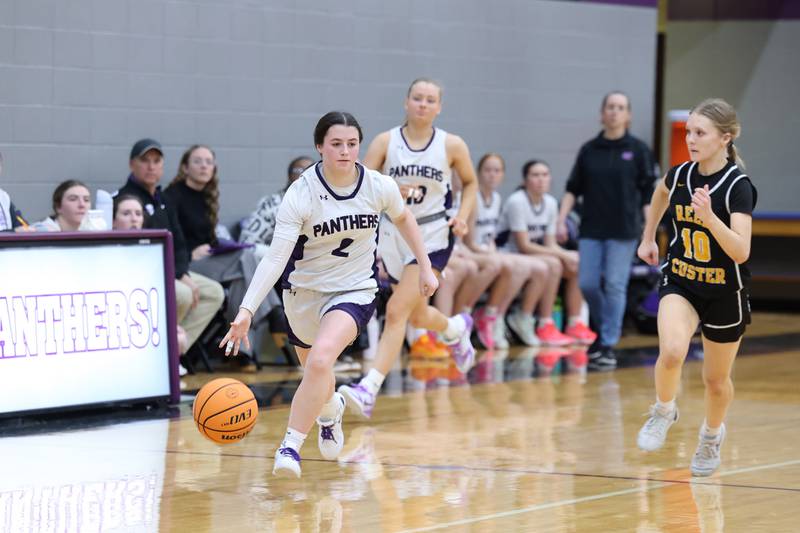 Manteno's Lila Prindeville breaks away on an offensive run as Reed-Custer's Kamryn Wilkey closes in during Reed-Custer's 45-42 victory over Manteno on Monday, Feb. 2, 2026.