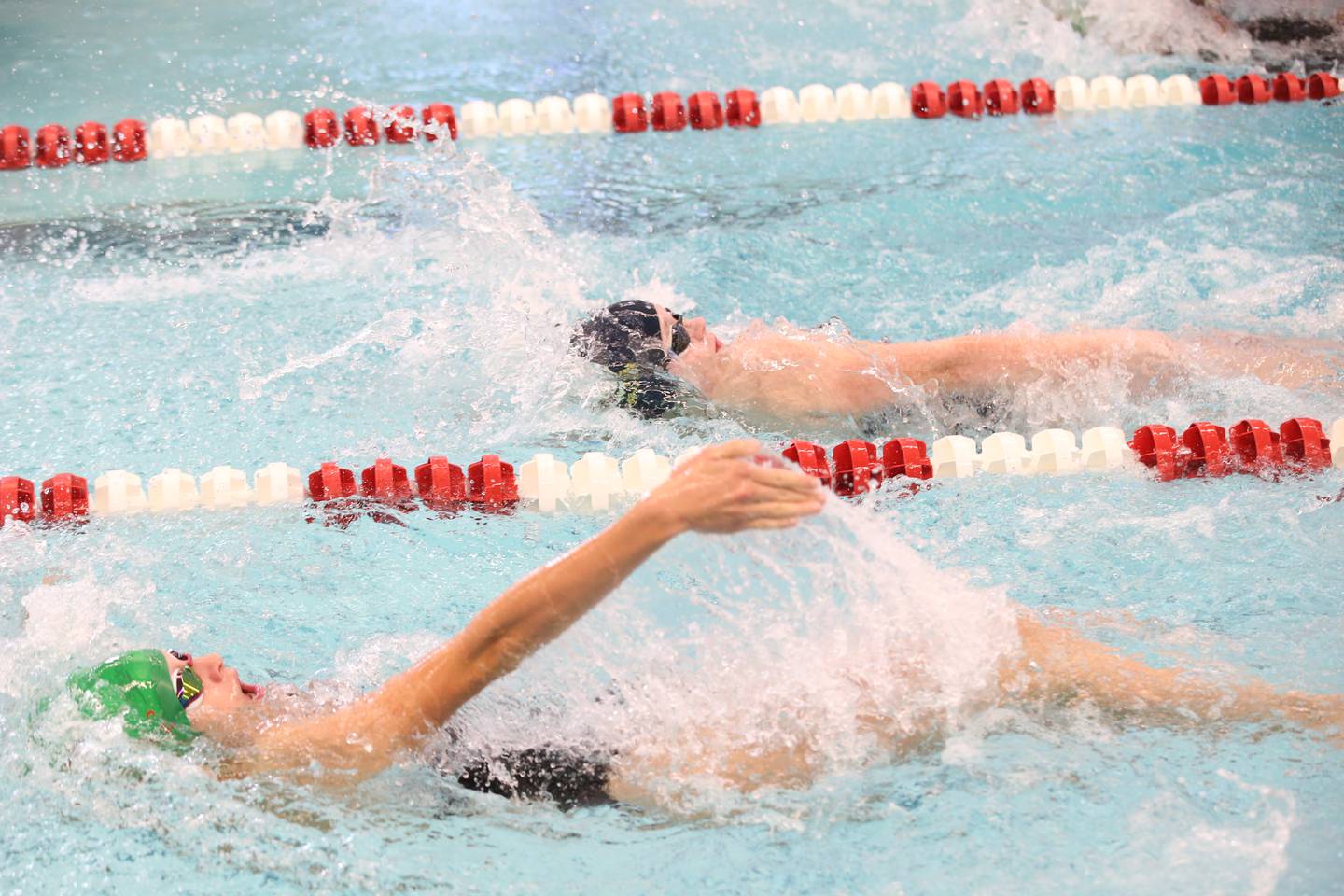 L-P Co-op swimmer Sam Nauman and Sterling's Payton Purdy compete in the 200 yard medley relay during a swimming meet on Tuesday, Oct. 10, 2023 at L-P High School.