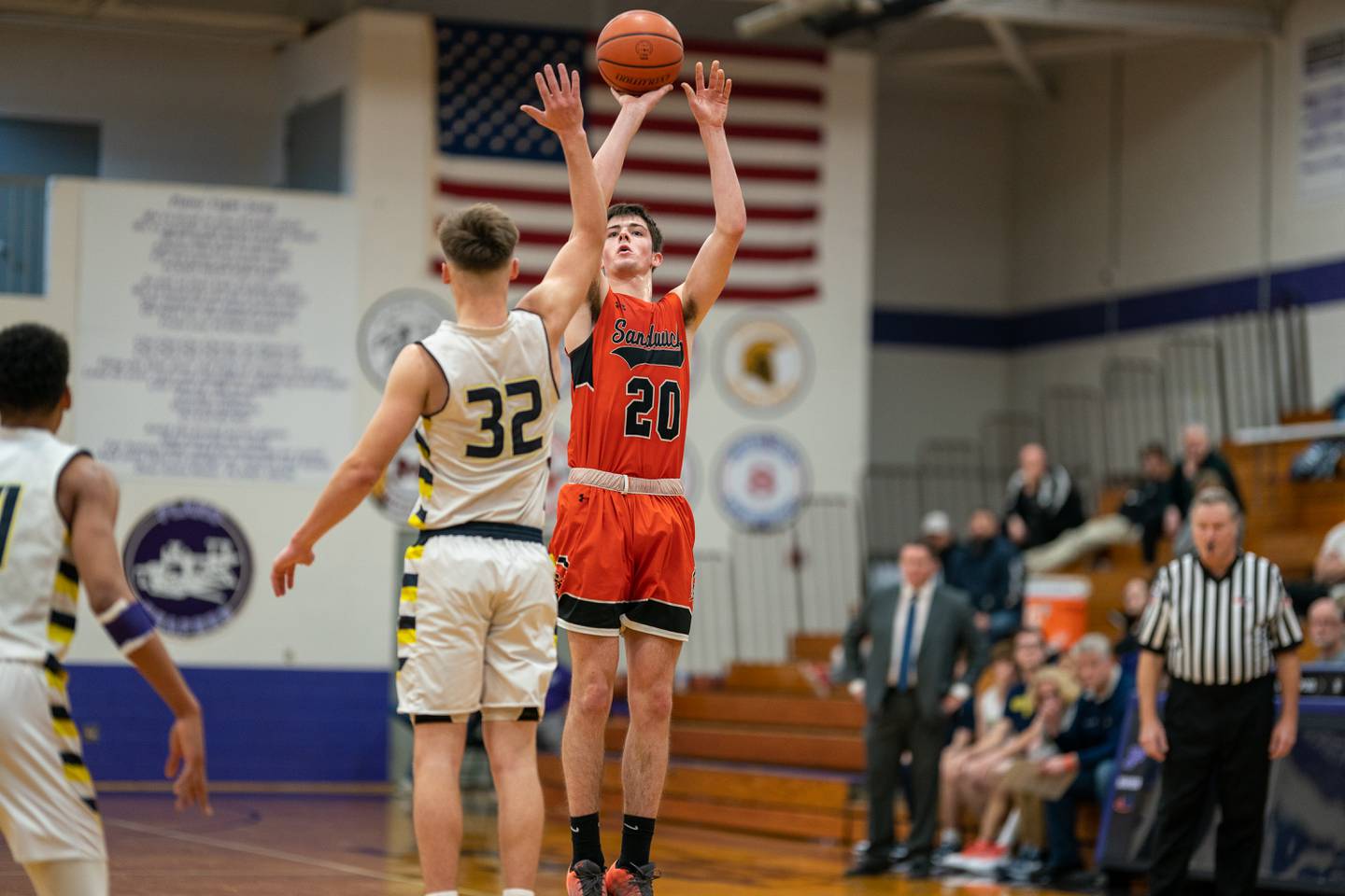 Sandwich’s Owen Sheley (20) shoots a three-pointer over Yorkville Christian's Trey Lombardo (32) during the 59th Annual Plano Christmas Classic basketball tournament at Plano High School on Tuesday, Dec 27, 2022.