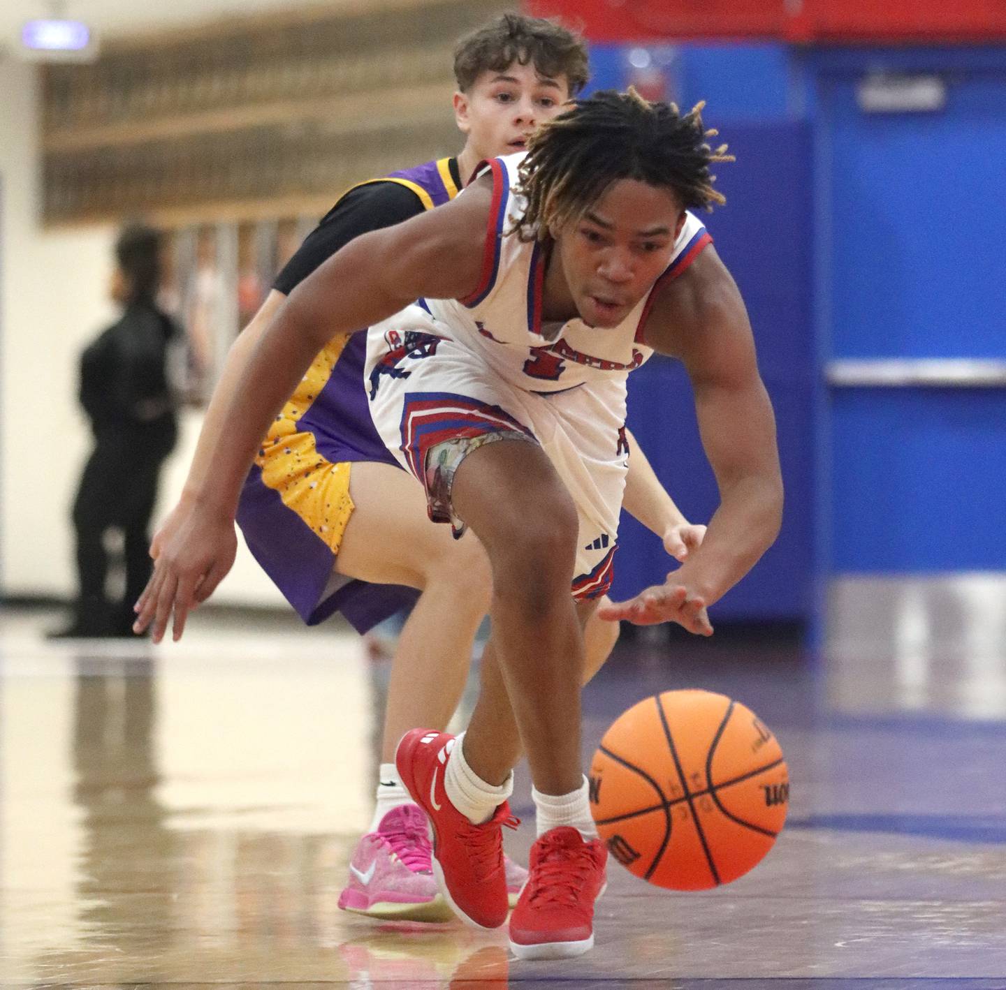 Dundee-Crown’s Rasheed Trice corrals the ball against Wauconda in varsity basketball Friday, Dec. 20, 2024 at Dundee-Crown High School in Carpentersville.