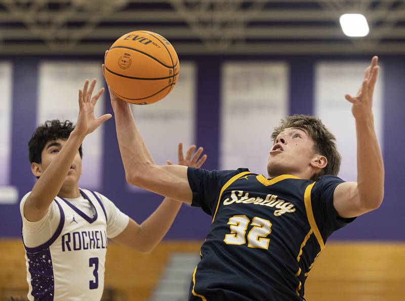 Sterling’s Jack Saathoff hauls in a rebound against Rochelle’s Kasin Avila Saturday, Jan. 3, 2026.
