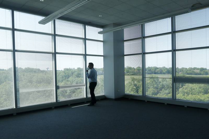 Green Data Center Real Estate Inc. CEO Jason Bak looks out of a corner office on the fourth floor of the property at the former Motorola headquarters on Thursday, June 10, 2021 in Harvard.