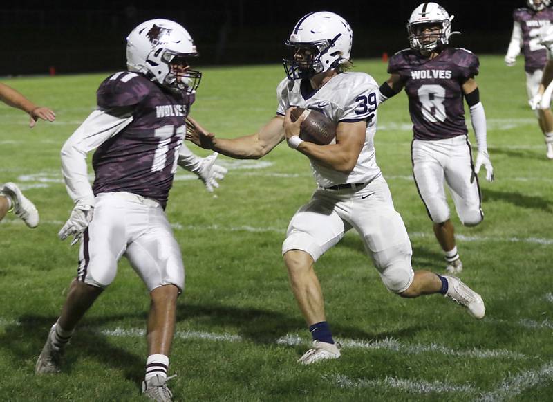 Cary-Grove’s Holden Boonetries to cut away from Prairie Ridge's Ben Gablenz during a Fox Valley Conference football game on Friday, Sept. 27, 2024, at Prairie Ridge High School.