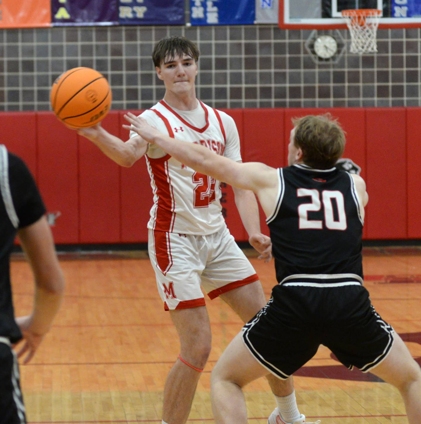 Morrison's Asher Ernst (23) passes the ball against Orion on Friday, Dec. 27, 2024 at the Cliff Warkins Memorial Basketball Tournament at Erie High School.