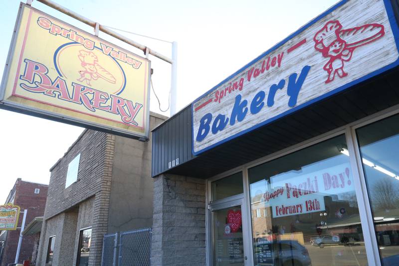 A sign says "Happy Paczki Day" at the Spring Valley Bakery on Tuesday, Feb. 13, 2024 downtown Spring Valley. A Paczki is a popular Polish-American tradition where bakeries make doughnuts filled with jelly and coated in sugar. The tradition is popular in the Illinois Valley for a Fat Tuesday feast.