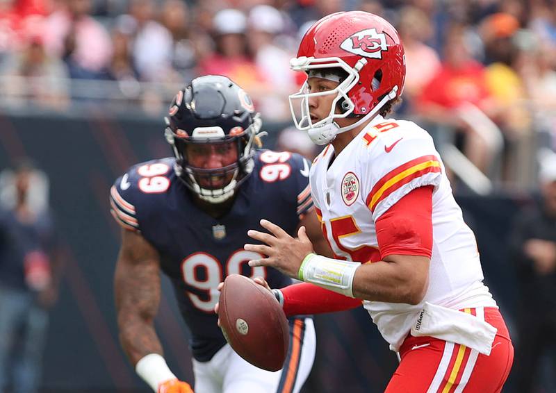 Chicago Bears linebacker Trevis Gipson chases a scrambling Kansas City Chiefs quarterback Patrick Mahomes during their preseason game Sunday, Aug. 13, 2022, at Soldier Field in Chicago.