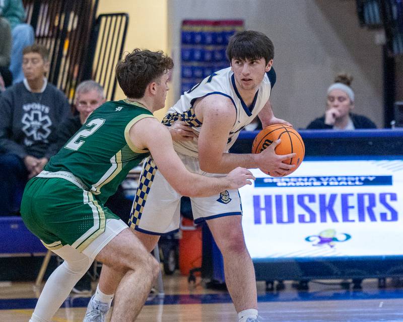 Marquette's Alec Novotney (15) holds ball in triple threat as St. Bede's Gus Burr (2) guards during the Class 1A Regional Boys Basketball Championship game on Friday, Feb. 27, 2026 at Serena High School.