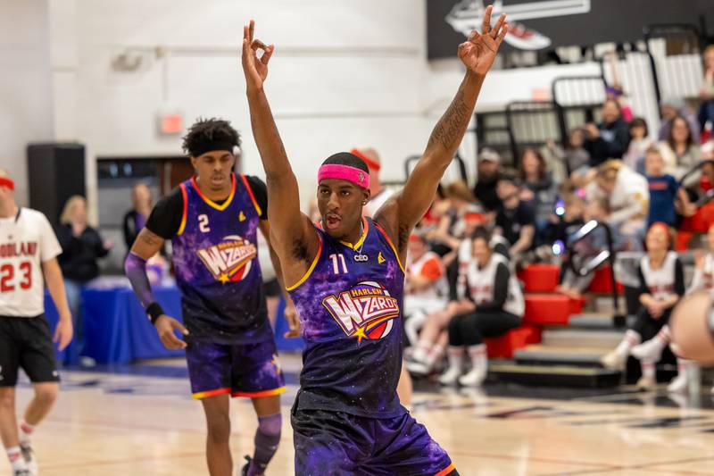 Kamil “Dragon” Brown (77) of the Harlem Wizards celebrates made three-point shot on Wednesday, April 16, 2025 at Woodland High School in Streator.