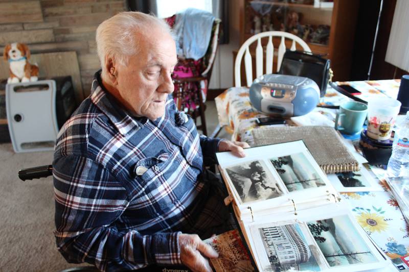 World War II veteran Peter Cirelli looks back on photos he took during his service in Toyko, Japan.