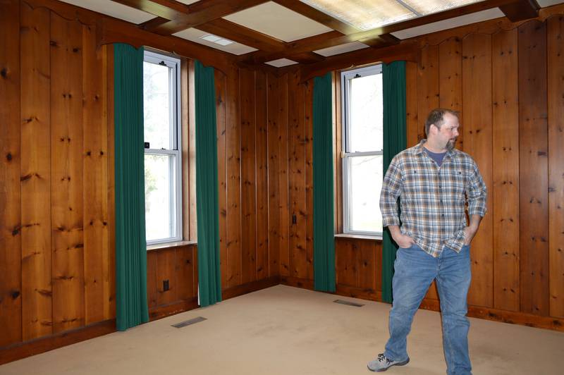 John Russell, of rural Mt. Morris, stands in what once was the office of Kable News Company's president and, further back, the dean of Mount Morris College on April 20, 2023. Russell closed on his purchase of the historic building on March 1; he plans to restore and modify it into multi-use space that benefits the community.