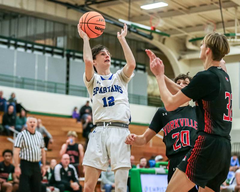 St Francis Tanner Hozian (12) puts up a shot during their Jack Tosh Holiday Classic basketball tournament game between St Francis at Yorkville Thursday Dec 26, 2024 in Elmhurst.