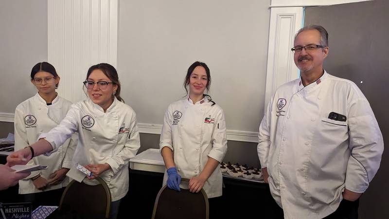 Students and staff of Joliet Junior College's culinary arts program serve chocolate treats at the Shorewood HUGS annual chocolate ball fundraiser on Saturday, Feb. 3, 2024, at the Posh Banquets & Event Center in Joliet. The fundraiser's theme this year was "Nashville Nights." Pictured, from left, are Elizabeth Ramos, Janie Pensado, Aubrey Sinchak, lab assistant; and Mark Mark Muszynski, professor of baking and pastry.