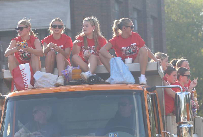 The L-P volleyball team rides a float along U.S. 6 during the L-P homecoming parade on Thursday, Oct. 2, 2025 downtown Peru.