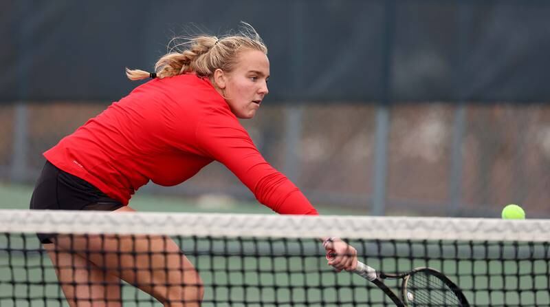Benet AcademyÕs Shane Delaney reaches to return a shot during in the 1A Doubles Final match at the IHSA State Tennis Finals Saturday October 21, 2023 in Buffalo Grove.