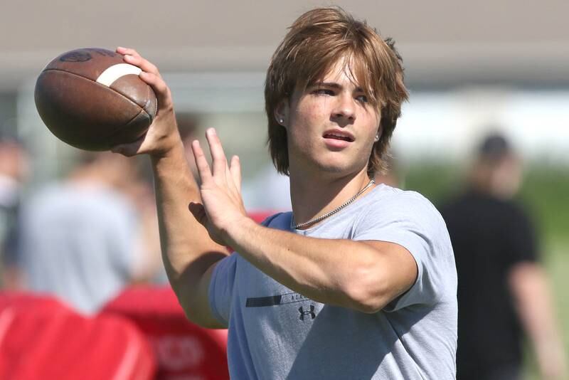 Sycamore's Eli Meier throws a pass Monday, June 27, 2022, during football practice at the school.