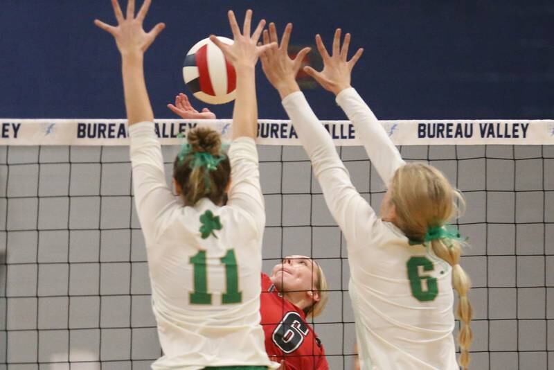 Seneca's Franki Meyers and teammate Graysen Provance block a spike from Erie-Prophetstown's Jamie Neumiller in the Class 2A Sectional semifinal game on Tuesday, Nov. 5, 2024 at Bureau Valley High School.