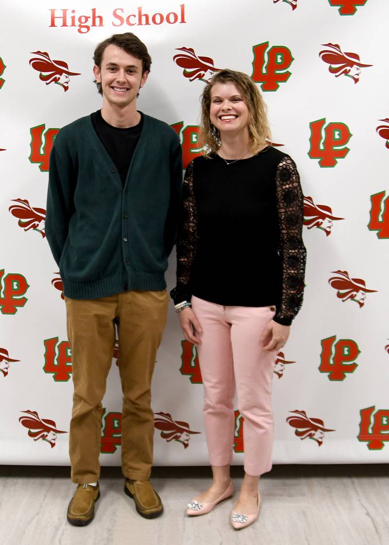 Connor Fundell (left) received the Jack Lyon Memorial Scholarship. The memorial scholarship is given to a senior who has taken four years of German classes, earned a 2.5 minimum GPA, and who submitted an essay on what they’ve gained from taking German at La Salle-Peru High School. The scholarship was presented by Christine Theisinger (right), L-P German teacher.