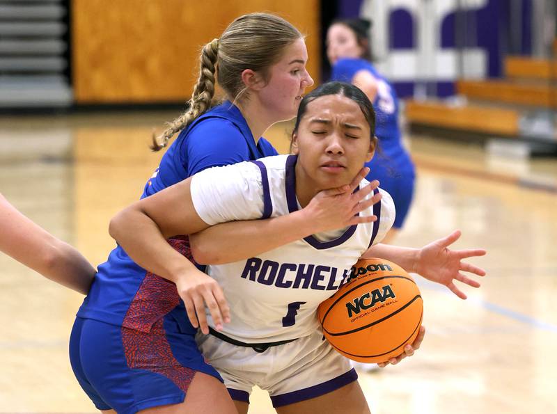 Rochelle's Carmela Bright is fouled by Genoa-Kingston's Arielle Rich during their game Monday, Dec. 15, 2025, at Rochelle High School.
