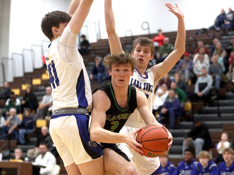 Crystal Lake South’s Colton Hess looks for an option against Lake Zurich in Hinkle Holiday Classic boys basketball tournament game action at Jacobs High School Wednesday.