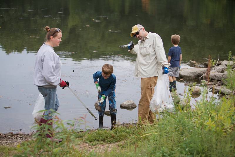 Volunteers pick up garbage during the Fox River cleanup event at Ferson Creek Park on Saturday, Sept. 16, 2023 in St. Charles.