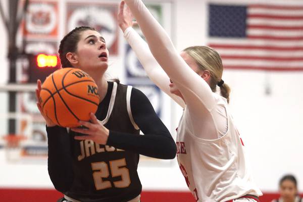 Olivia Schuster shows off post moves as Jacobs rolls past Dundee-Crown