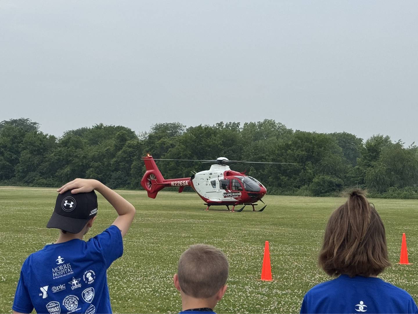 Camp 911 kids watch as the helicopter takes off on Friday, June 13, 2025.
