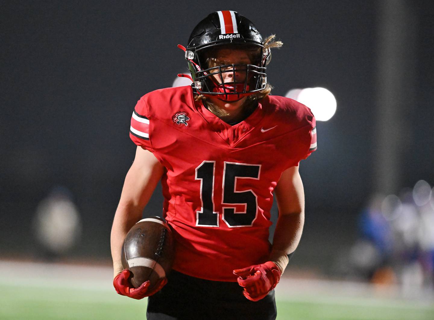 Lincoln Way Central's Tyler Tulk (15) scores a touchdown in the first quarter during the Class 7A second round playoff game against Hoffman Estates on Friday, Nov 08, 2024 at New Lenox. (Dean Reid for Shaw Local News)