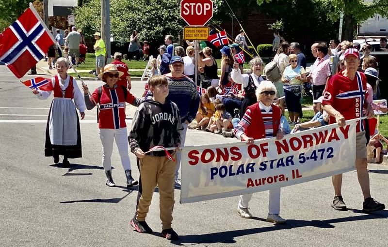Sons of Norway Polar Star Lodge 5-472 members marched in a Park Ridge parade celebrating Syttende Mai, Norway Constitution Day, on Sunday, May 21, 2023. Banner carriers from left are Kevin Czenk, Aurora; Fran Berg, Aurora; and Ken Johnson, Yorkville.