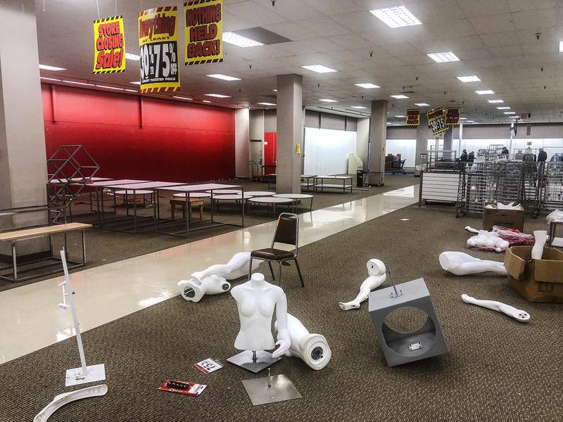 Pieces of mannequins and furniture lay on the floor Friday, Jan. 4, 2019 at Sears in Joliet.