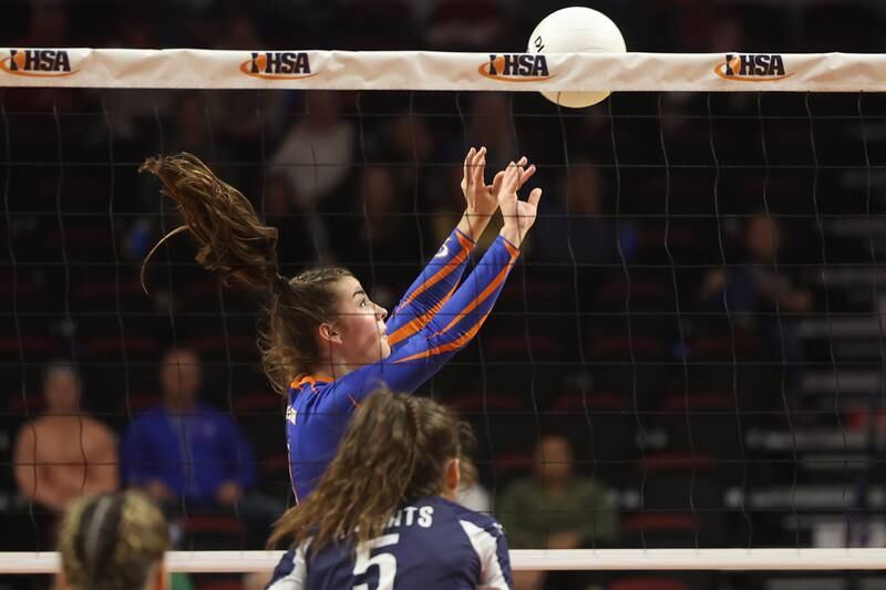 Genoa-Kingston’s Alivai Keegan sets the ball against IC Catholic in the Class 2A championship match on Saturday in Normal.