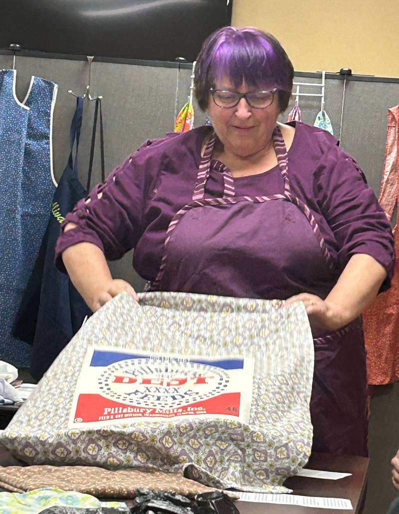 Connie Barr speaks about the cultural importance of aprons during a special presentation about her apron collection on Tuesday, April 23, 2024, at Morrison's Odell Public Library.