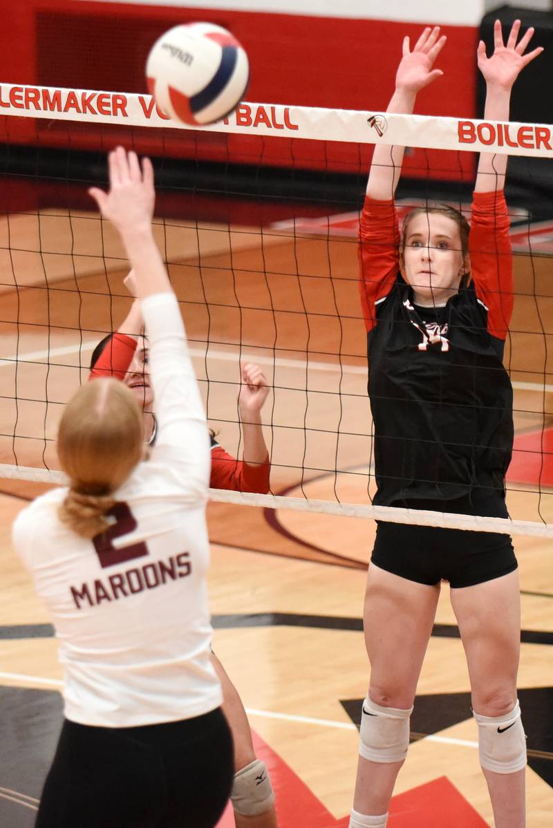 Bradley-Bourbonnais' Jamisen Parker, right, looks to block a hit from Champaign Central's Hayden Curtis during a game at Bradley-Bourbonnais Thursday, Oct. 23, 2025.